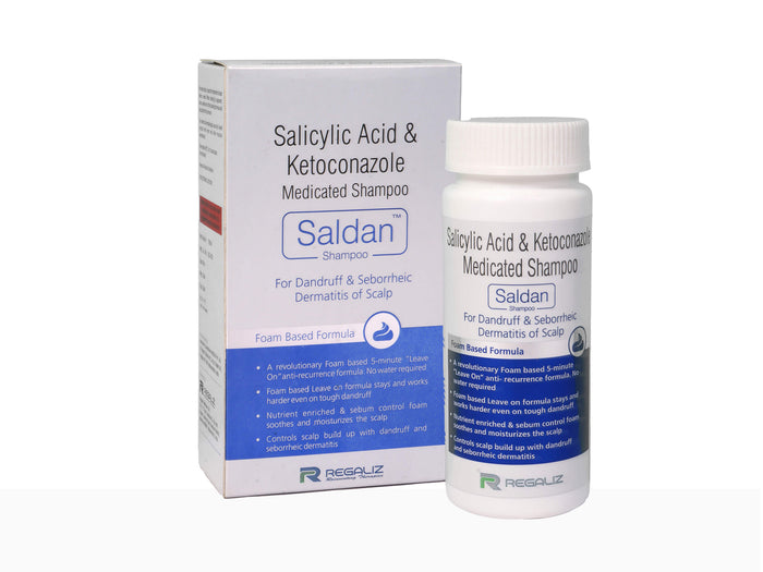 A bottle of SALDAN shampoo next to its packaging box. The packaging is primarily white and blue with text detailing the product name, purpose, and instructions.